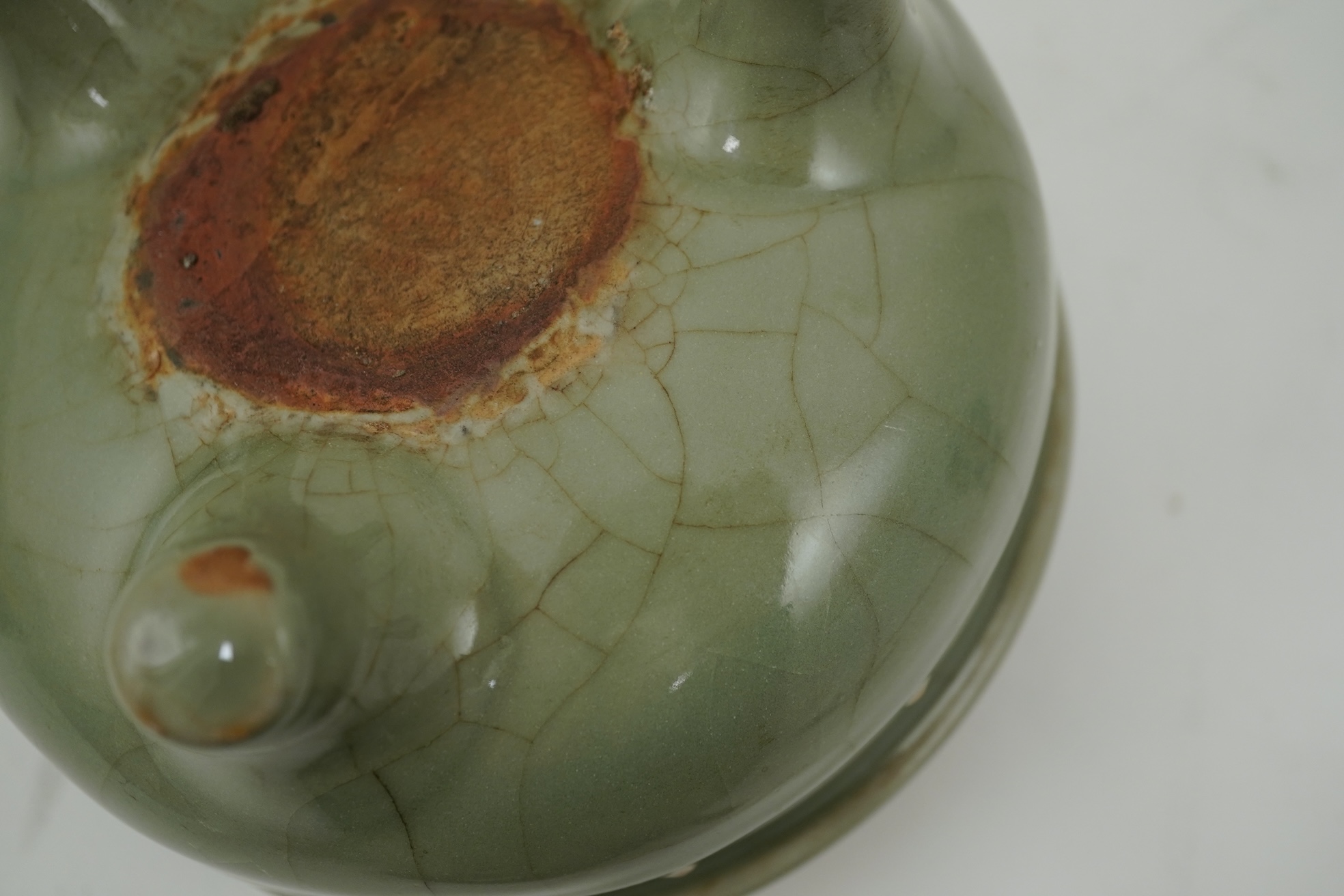 A Chinese Longquan celadon crackle glazed tripod censer, Ming dynasty or later